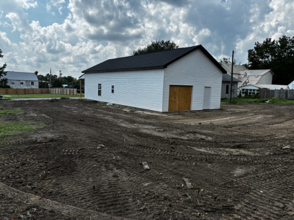 Shop pad graded with clean tire tracks